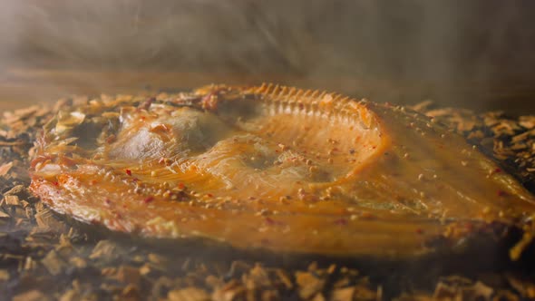 Cooking Smoked Ide Fish with Seasonings on Decayed Shavings