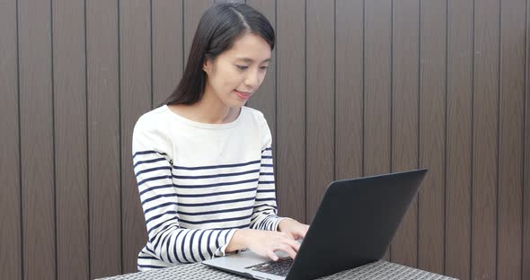 Woman using notebook computer