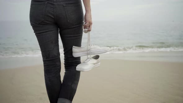 Cropped Barefoot Woman Standing on Sand Beach