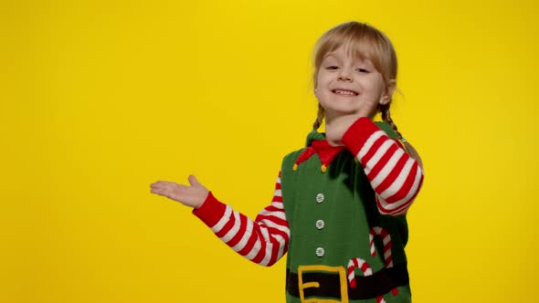 Kid Girl Christmas Elf Santa Helper Costume Points Fingers Blank Space Shows Advertising Area