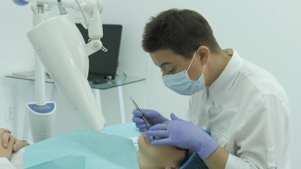 Dentist finishing a whitening treatment