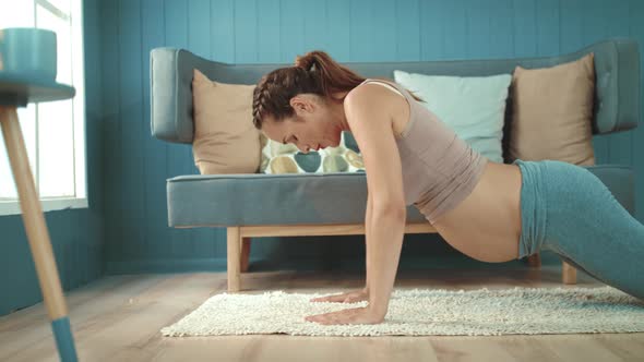 Closeup Joyful Pregnant Belly Mother Doing Yoga Exercise in Living Room.