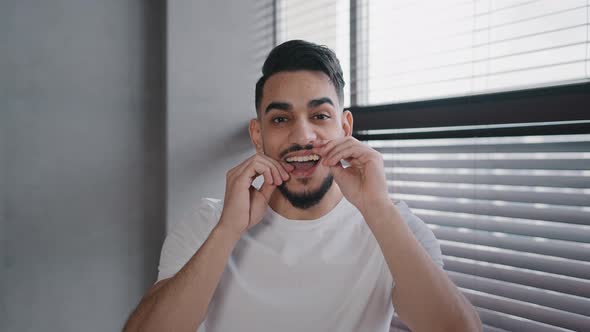 Portrait Millennial Handsome Bearded Arab Indian Male Guy in White Shirt Brushing Teeth Using Dental