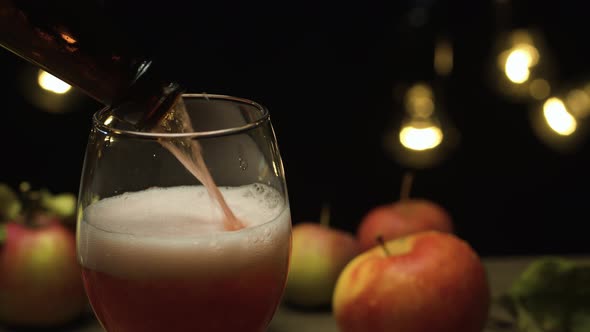 Apple cider pouring into a glass