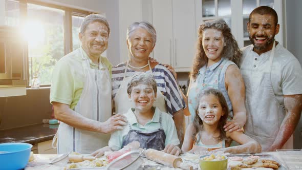 Happy family standing in kitchen at home 4k