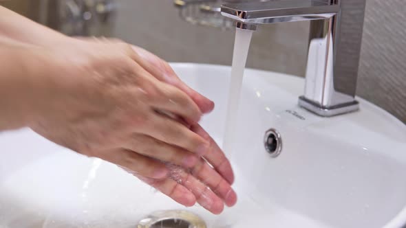 Adult Male Washing His Hand Using Antibacterial Soap