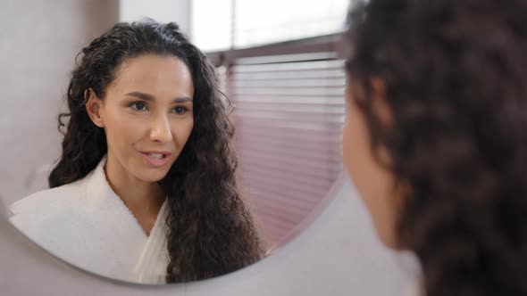 Young Happy Confident Woman Standing in Bathroom Looking in Mirror Rehearsing Speech Instructs