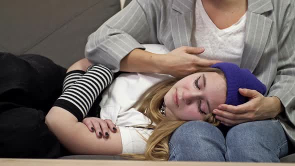 Mom Hugs Her Teenage Daughter