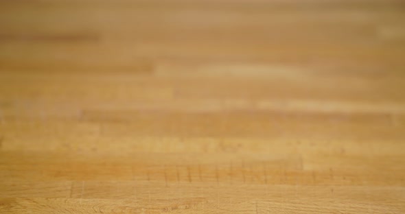 Cutting Eggplant on Wooden Background