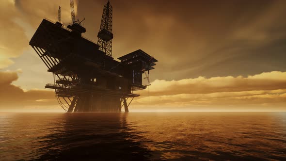 Offshore Jack Up Rig in The Middle of The Sea at Sunset Time