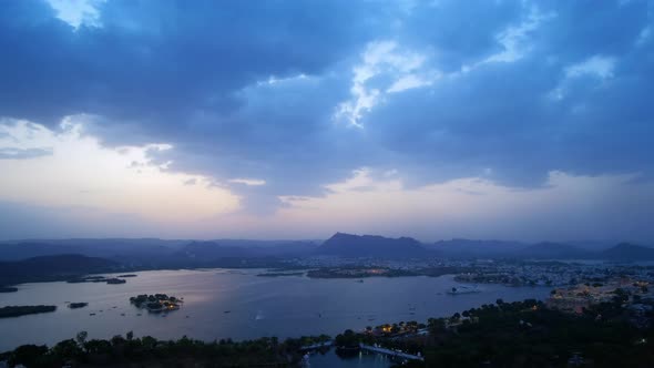 Evening view of Udaipur city skyline and lake Pichola time lapse.