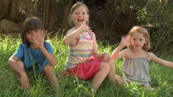 Children waving at camera