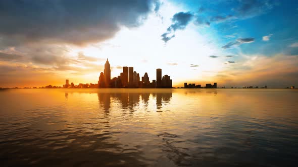 Skyline with Skyscrapers and Sea at Sunset