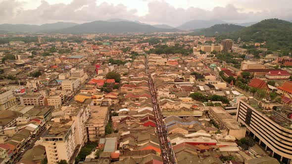 Aerial view Drone flying over phuket city Thailand.Drone over a street night market in Sunday day