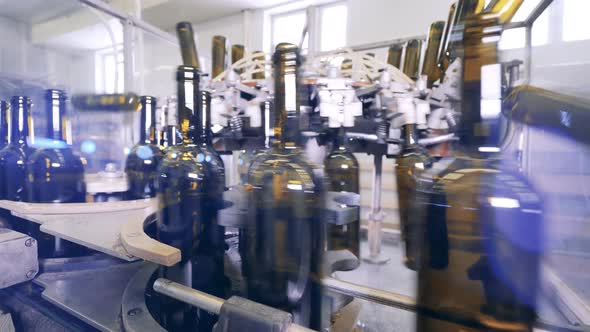 Close Up View of Wine Bottles Moving Along the Conveyor Belt