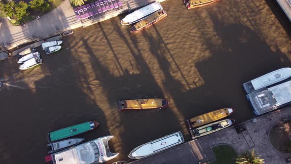 Tourist boat arriving at Tigre river dock port in Buenos Aires province, Argentina. Aerial circling