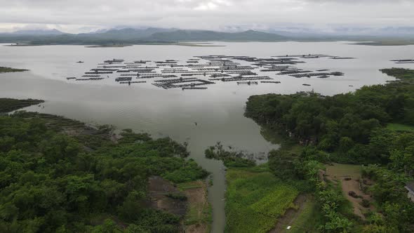 Aerial view of traditional floating fish pond on lake in Indonesia