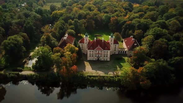 Beautiful aerial view of castle in autumn season. Popular palace and travel destination. Aerial shot