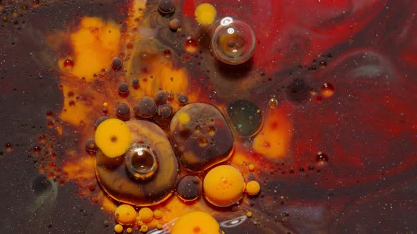Ink Bubbles Mixed with Liquid Substance of Oil Milk Soap Bright Acrylic Paint on Colorful Surface