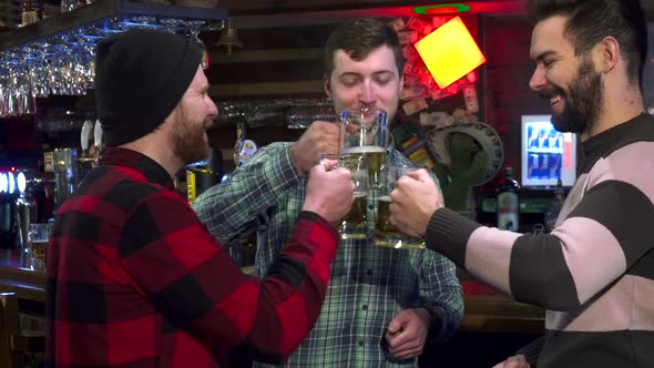 Friends Clink Their Glasses at the Pub