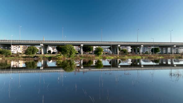 Traffic in the reflection of water aerial view 4 K