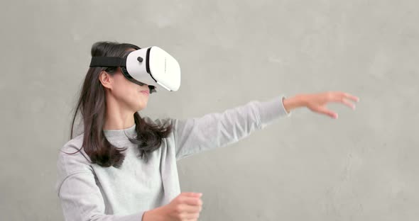 Woman playing game with VR device