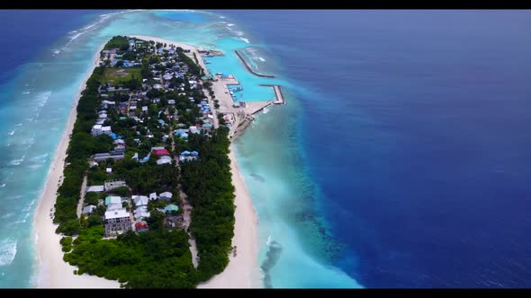 Aerial top down panorama of idyllic sea view beach trip by blue lagoon with white sandy background o