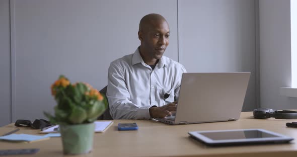 Smiling businessman workin in office