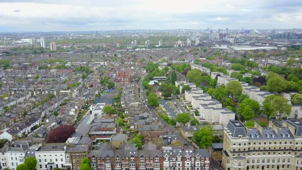 Panning shot of London residential streets with row houses in summer