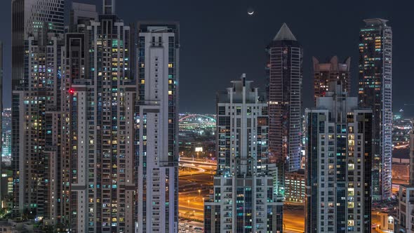 Modern Residential and Office Complex with Many Towers Aerial Night Timelapse at Business Bay Dubai