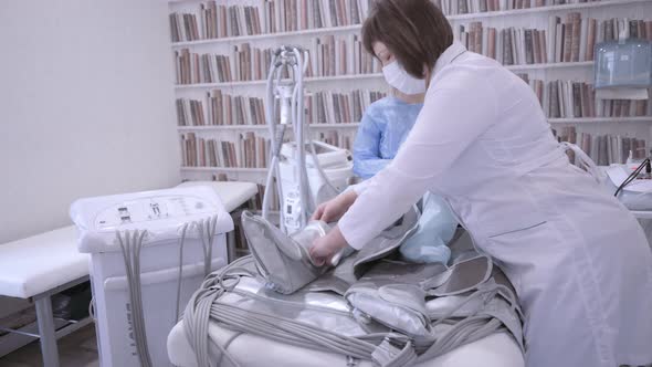 Beauty Therapist Conducts a Pressotherapy Procedure