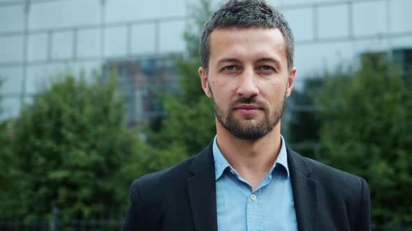 Portrait of Attractive Young CEO with Serious Face Outdoors in City Center