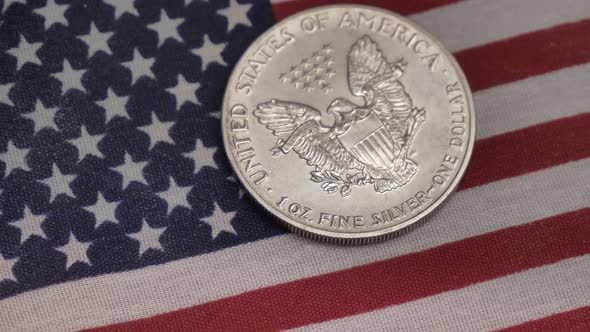 Silver dollar and American flag