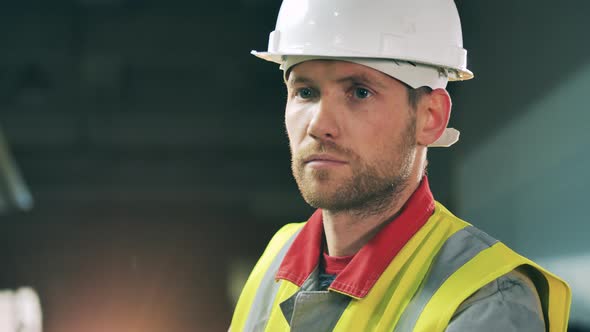 Face of a Male Industrial Worker Wearing a Hardhat