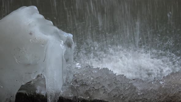 Waterfall Drops of Ice Water on the Ground