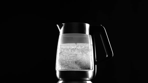 Electric Kettle Begins To Boil. Black Background