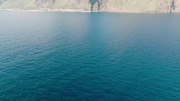 Flight over Atlantic reveals imposing mountainous coastline of Madeira