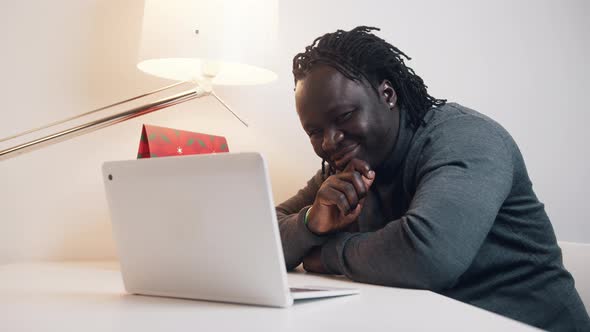 Young African American Black Man Having a Video Call Using Laptop