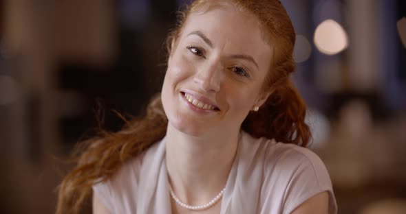 Redhead Woman Writing on Notepad Portrait