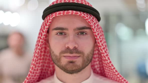 Close Up of Face of Serious Young Arab Man