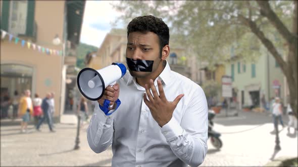 Expressive Man with Black Tape Over Mouth