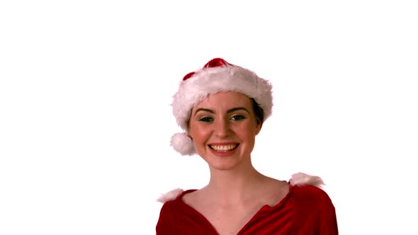 Pretty girl in santa costume smiling at camera