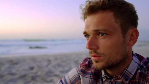 Man at beach during sunset 4k