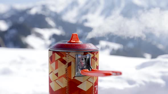 Pot with Boiling Water at Gas Stove in the Mountains