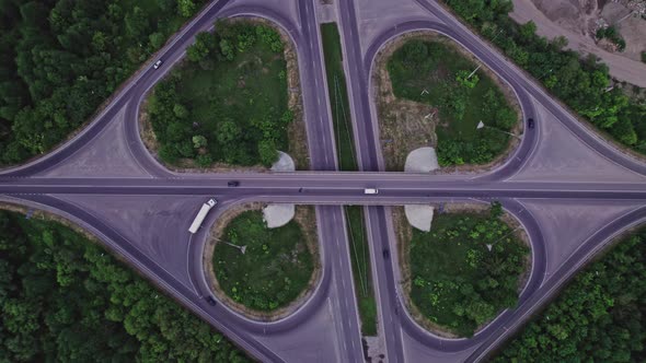 Aerial View of Road Junction with Moving Cars