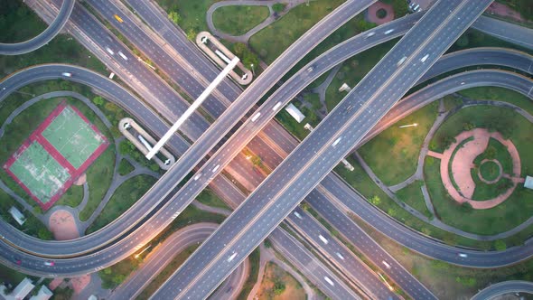 4K : Aerial Hyper lapse drone view of road junction with moving cars.