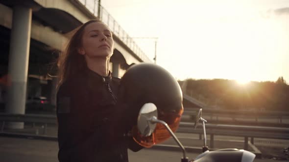 View in Profile Beautiful Longhaired Woman Stopping at Side of the Road Sitting on Motorbike Taking