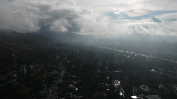 Drone footage of the San Fernando valley at the 210 freeway at Osbourne. Drone is flying through the