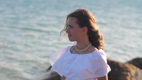 Young Woman Poses in the Wind