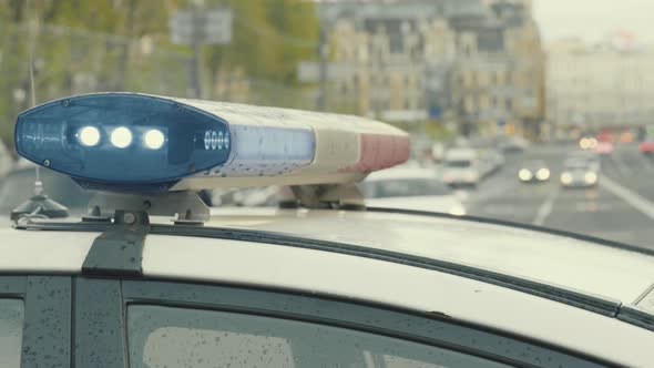 Flashing Flasher on the Roof of a Police Car. Blinker. Close-up.